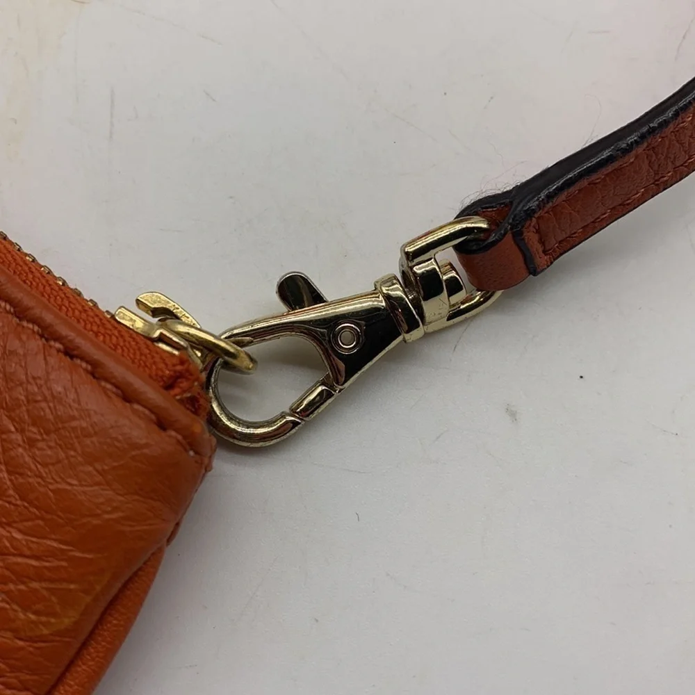 Michael Michael Kors Orange Gold Wristlet. SM1714